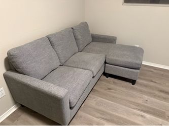 Gray sofa/couch with leg rest