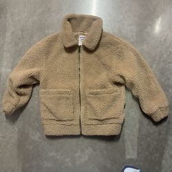 Teddy bear jacket’s brand is garage. 