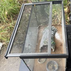 Reptile habitat with accessories and heater pad 