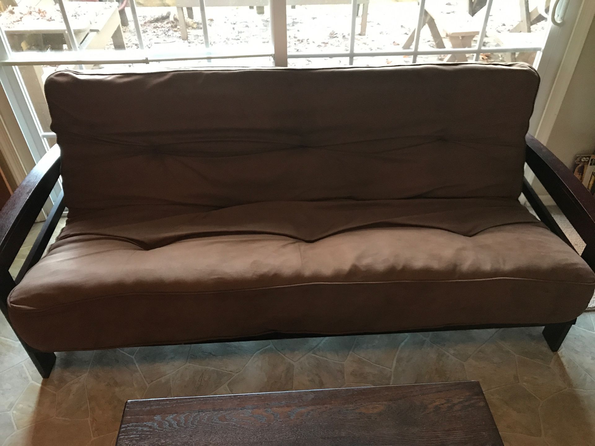 Espresso wood futon with like new 8 inch mattress.