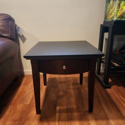 Wood End Table With Black Top And Front Drawer 