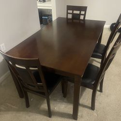 Signature Design by Ashley Bennox 6-Piece Engineered Wood Dining Set in Brown
