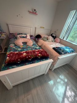 Two full beds with vanity and storage
