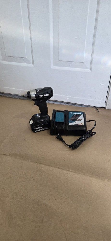 MAKITA 18 VT BRUSSELS IMPACT 3/8 + BATTER 5.0 AND CHARGER
