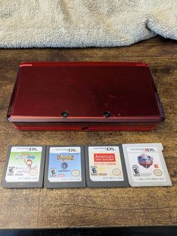 Red Nintendo 3ds with 4 games