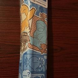 Pokémon TCG NAIC 2025 Psyduck playmat and cover.