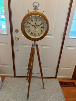 Floor clock on tripod wood stand