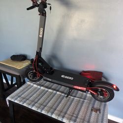 BHER  SCOOTER ELECTRIC  SPORT BRAN NEW I USED IT LIKE 3 TIMES 