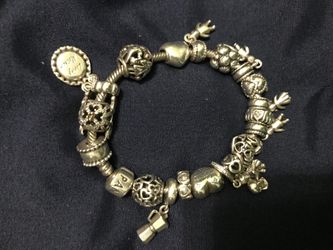 Authentic Pandora bracelet with 20 charms some limited edition ones $950
