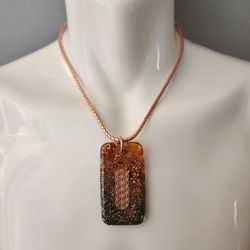 Orgonite Pendant with Pyrite and Carnelian – Copper and Resin, Pure copper Chain, EMF Protection, Handmade High-End Energy Jewelry
---
This high-end O