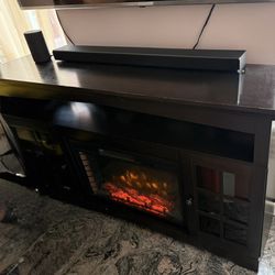 Under TV Stand With Electical Fire.