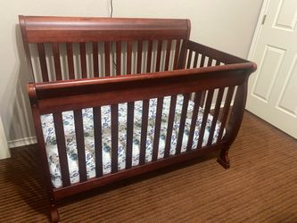 DaVinci Kalani 4-in-1 convertible crib, Toddler Bed conversion kit (unopened), and twin/full size conversion kit (unopened), cherry wood