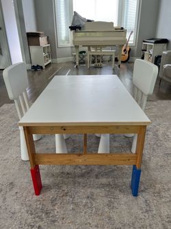 Wooden table with two white chairs great condition