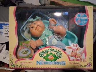 Cabbage patch dolls. In fair condition. Never opened box. Certificate inside