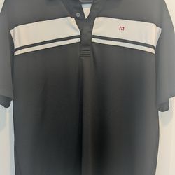Travis Mathew golf shirt size Large. Logo on sleeve
