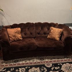 Vintage brown suede couch on wheels