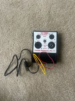 vintage Kalbar Products “Test-Tronic Electronic Tester.” It is essentially a small vacuum-tube tester for checking tubes used in older TVs, radios, an