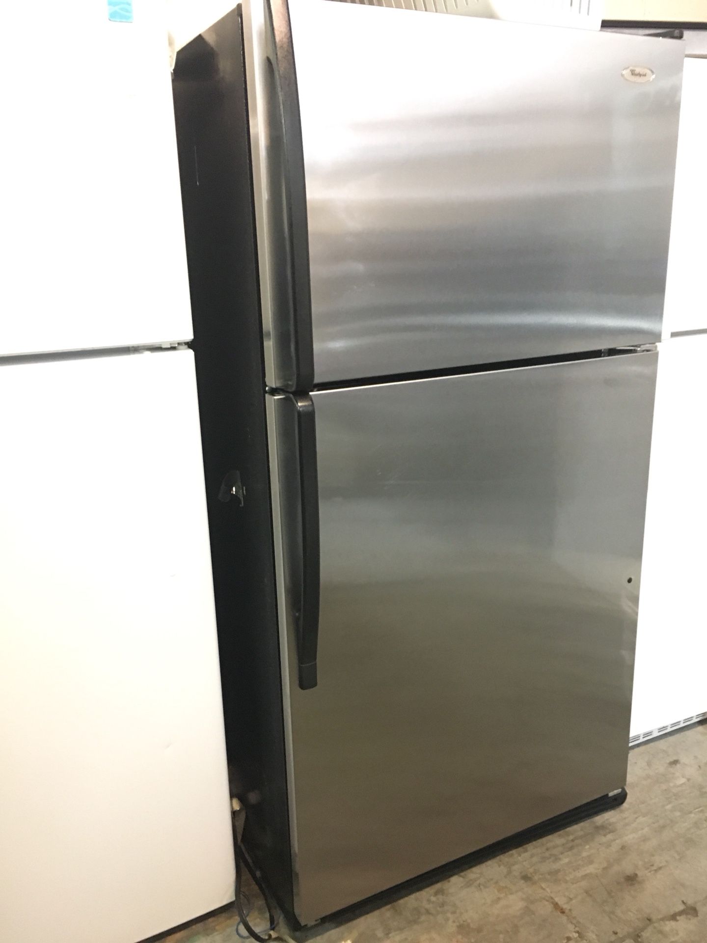 Stainless steel top freezer 21cuft whirlpool refrigerator. 33inch wide X 66”h