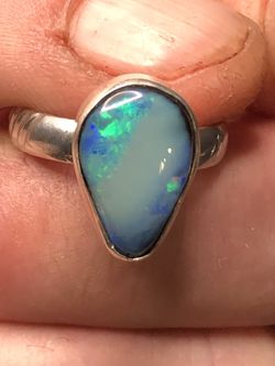 Australian Semi/Black Lighting Ridge Opal Ring. Blue Teardrop Opal is 3.5ct 16x11x5mm on a accented shank. Nice pear shaped cabochon Size 8 Ring