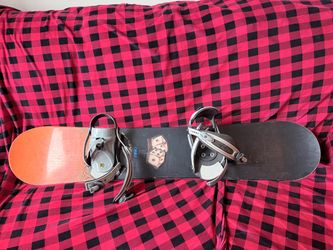Two snowboards and boots