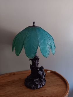 Brand New table lamp featuring a bronze finish Resin Base