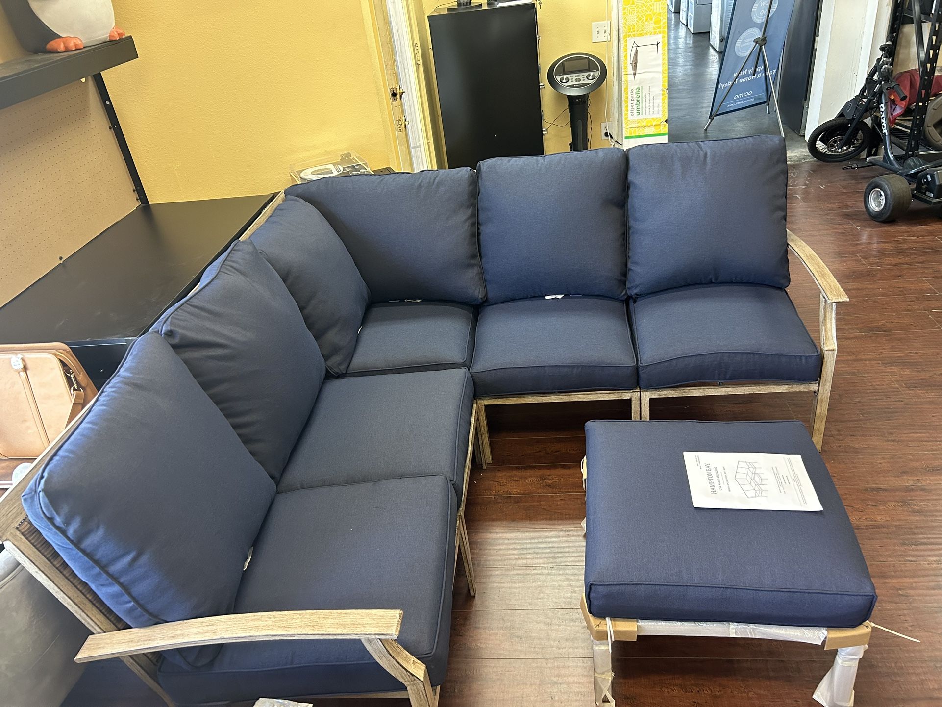 Hampton Bay Geneva 6 Piece Brown Wicker Outdoor Sectional Sofa Seating Set with Ottoman and CushionGuard Midnight Navy Blue Cushions for Sale in Downey CA OfferUp