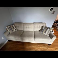 Cindy Crawford Beige Home Sofa w/ decorative pillows