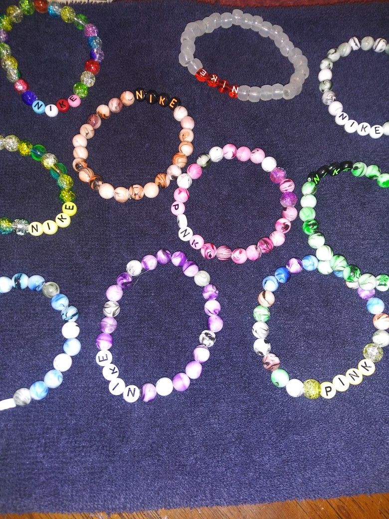Nike. Pink. Bracelets