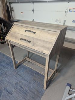 Modern greyish brown wooden secretary desk very good condition and clean. Opens up. 34in wide, 39in tall, 11in deep and 31in deep when open