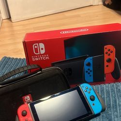 NINTENDO SWITCH IN BOX WITH DOCKING STATION, CASE, MEMORY CARD AN MARIO KART 8. NO TRADES CASH ONLY 