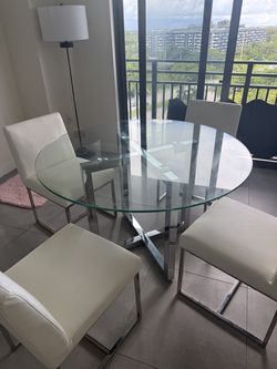 4 chairs and a round table