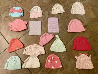 Newborn baby girl hats. Various colors and designs.