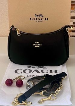 Small black purse with charm and box