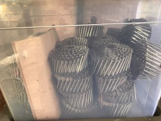 Box full of rolls of nails for nail gun