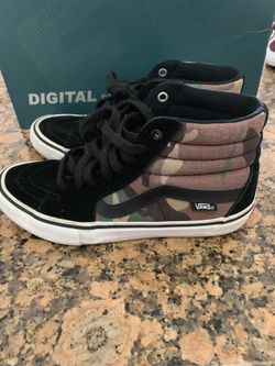 High top camouflage and black vans