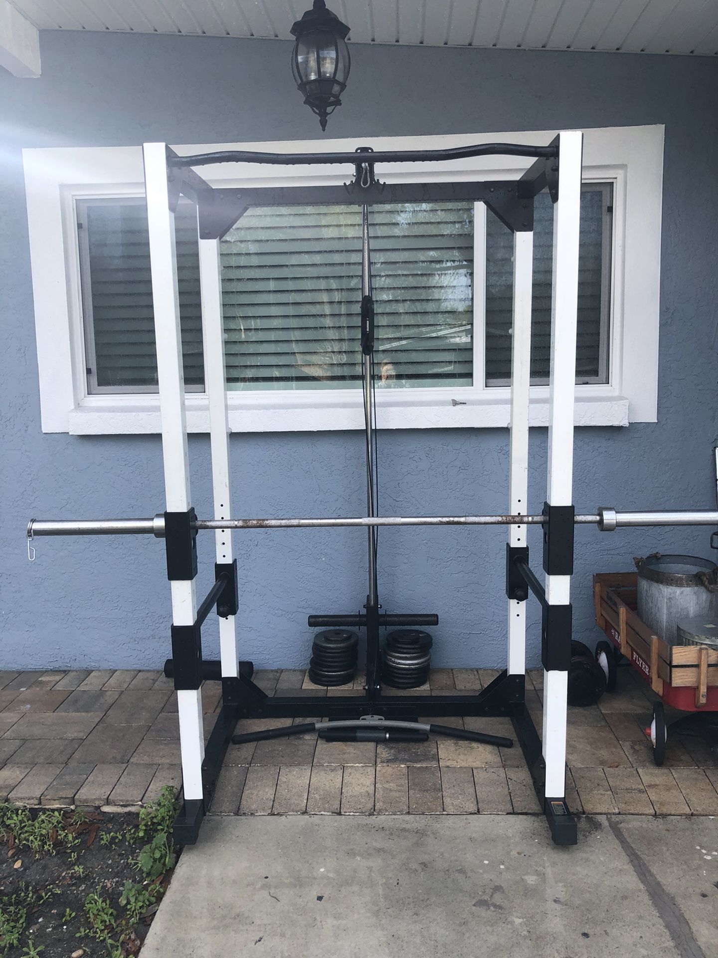 Full squat rack with high and low pulleys and pull up station with Olympic barbell