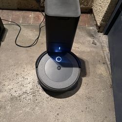 Two Roomba Vacuums
