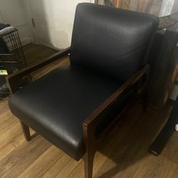 Two Black Leather Lounge Chairs
