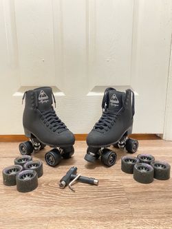 Black skates size 6 with extra wheels and adjustment tools