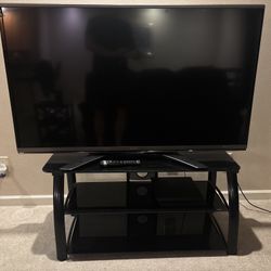 60” TV and Entertainment Stand