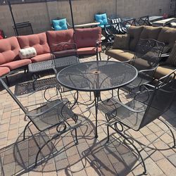$200 IRON PATIO SET 4 ROCKING CHAIRS AND TABLE
