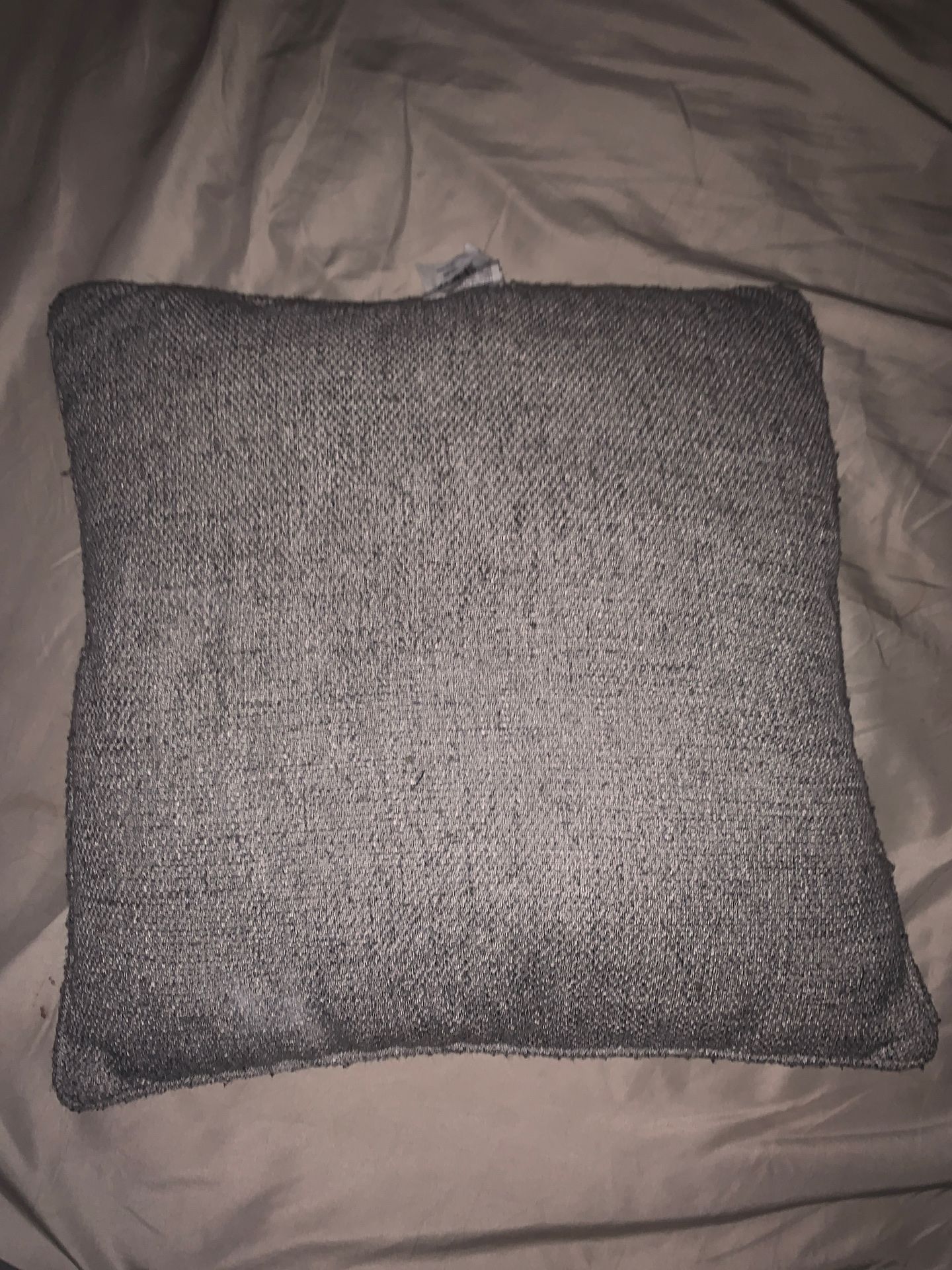 Grey throw pillow