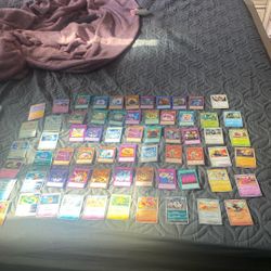 Laura Kona cards, a couple baseball cards and some Pokémon cards and some Yu-Gi-Oh cards