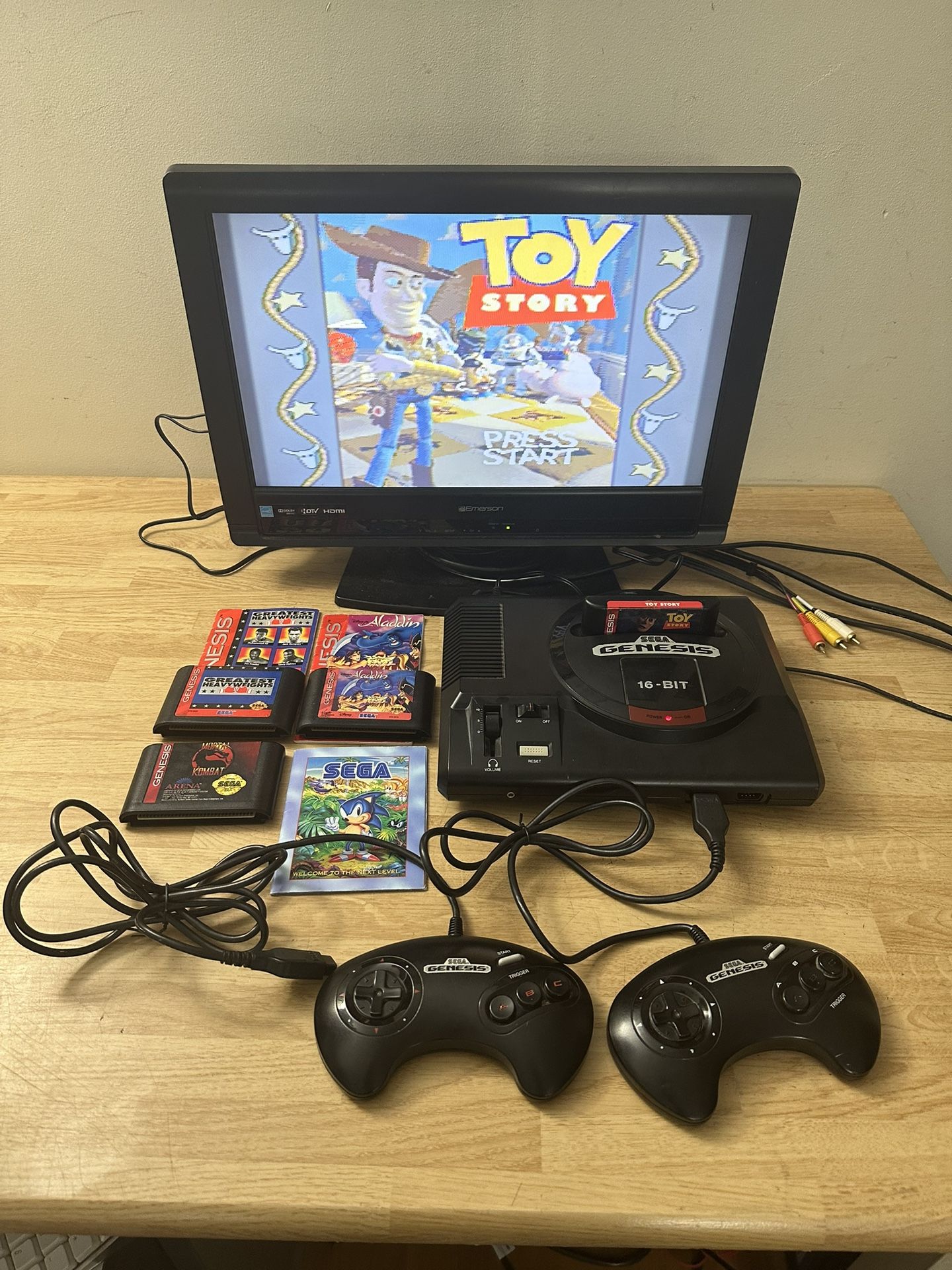 SEGA GENESIS 1 - MODEL 1601 - 16-BIT VIDEO GAME CONSOLE W/ 4 GAME CARTRIDGES, TV WIRE, POWER CORD, & 2 GAME CONTROLLERS