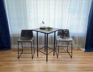 Wooden table and leather chairs