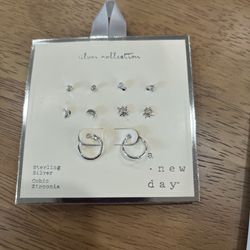 A new day sterling silver cubic zirconia set of earrings new never used