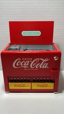 Vintage 1990's coca cola die cast table top battery operated cooler style musical vending machine plays coca cola jingle tune like new never handled l