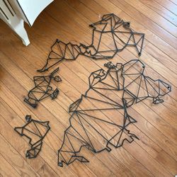 Black world map stencil wall art