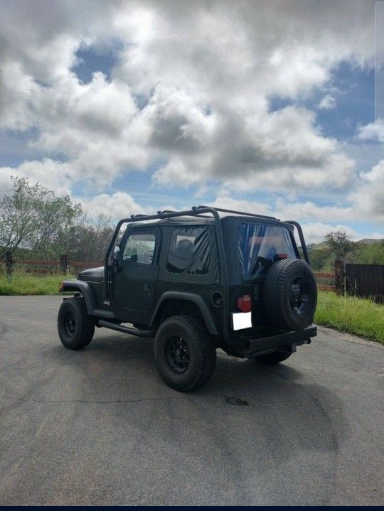 Jeep Wrangler TJ With Roof Rack Tires