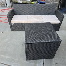 Wicker couch with wicker container and cover